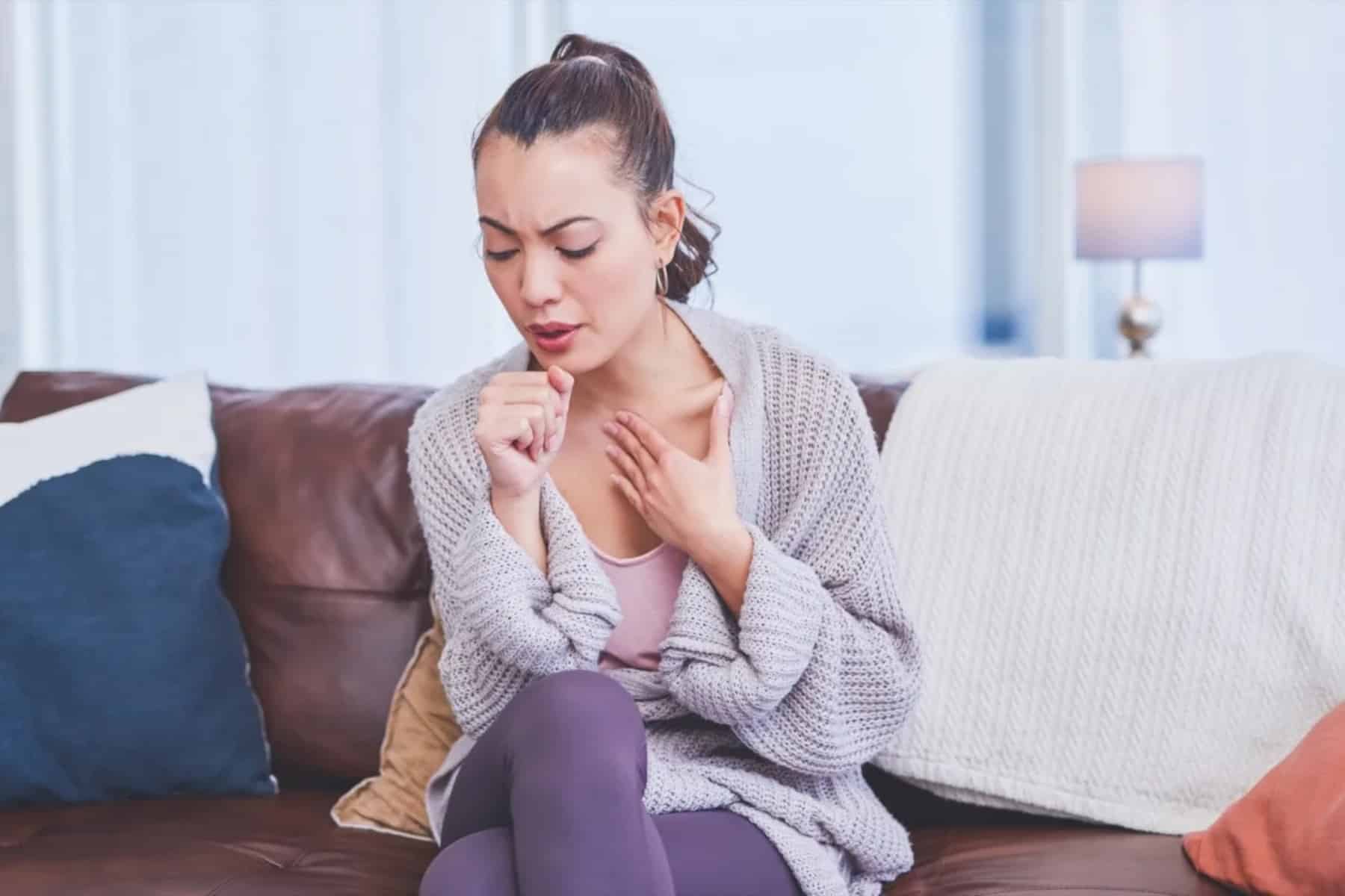 woman cough chest bed sick ill cold