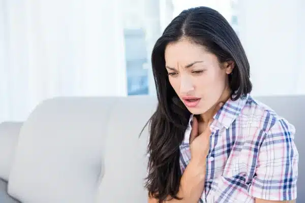woman cough breathing problem e1678551103802