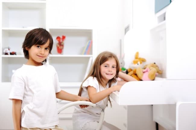 siblings boy and girl in room